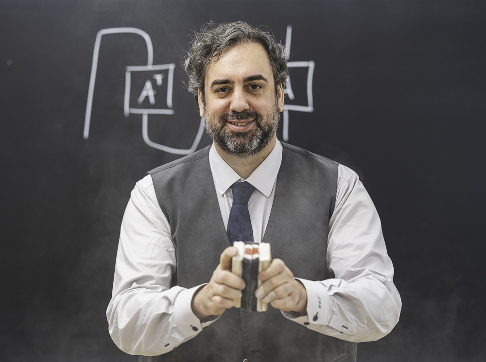 Jacob Biamonte at a blackboard, tensor diagrams behind him.